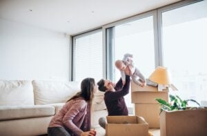 Family moving in new house with baby