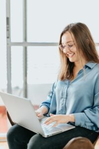 Woman typing on laptop