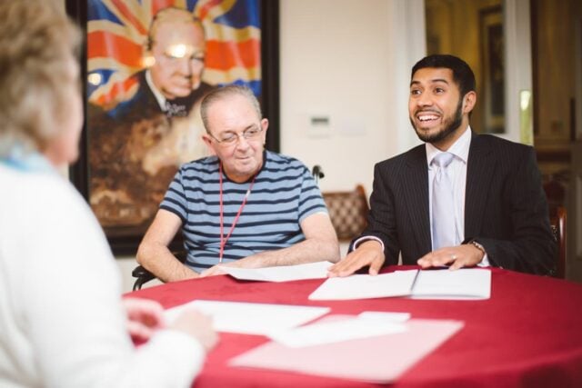 Mani talking to client