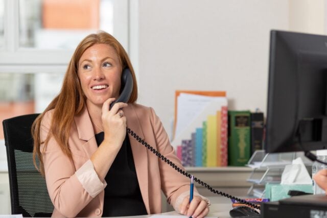 Holly speaking on the phone