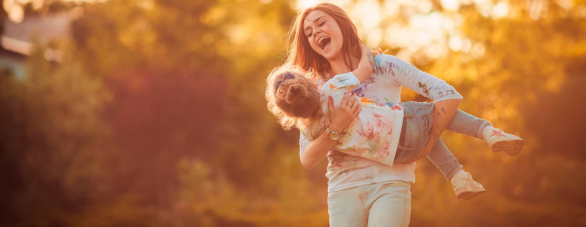 Lady swinging around child