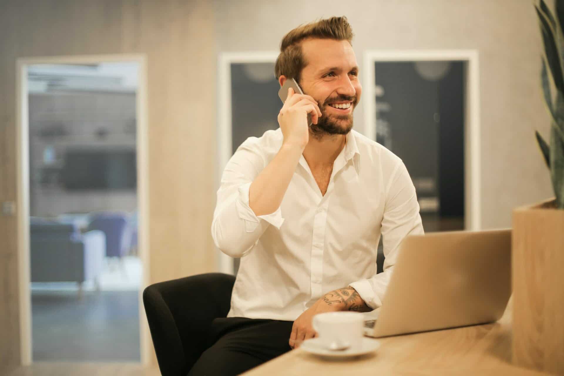 Man taking a phone call at his desk