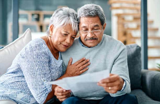 Couple looking at a letter