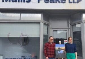 Martin and Esther outside the Shenfield office.